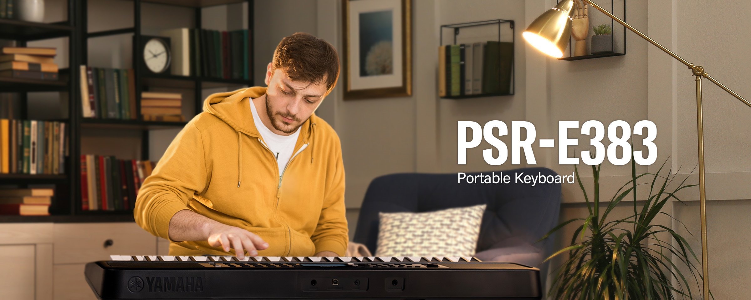 The man is playing the PSR-E383 enthusiastically.